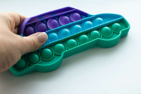 Woman hands with an antistress  toy. Simple dimple toyの写真素材