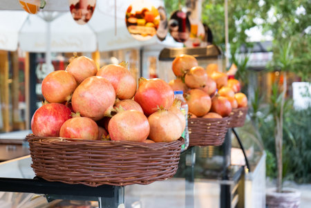 Ripe pomegranates in baskets for making juice on the street in Turkeyの写真素材