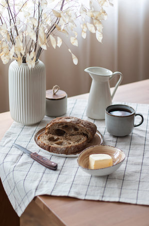 Still life with bread and butter in wabi-sabi styleの写真素材