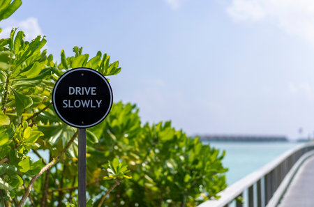 Sign Drive Slowly on a bridge at resort in he Maldivesの写真素材