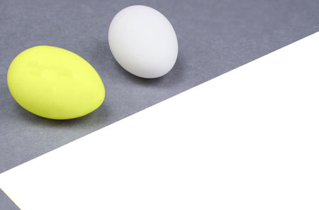 Easter eggs on gray background. Colors of year 2021 gray and yellow. Copyspace for text, mockup. Minimalism conceptの写真素材