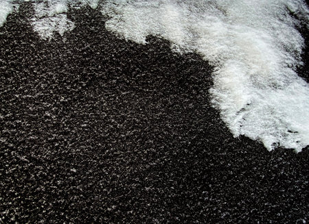Snow pattern isolated on black background. White hoarfrost texture for designの写真素材