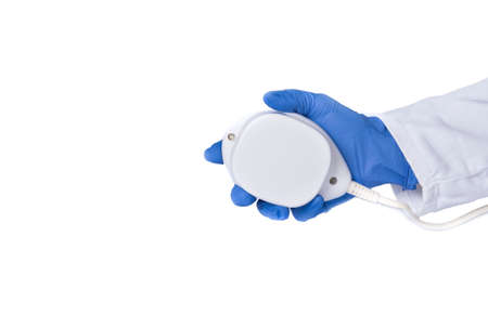 Magnet therapy. Hand with magnetic field device. Physiotherapy, magnet treatment, close-up of...
