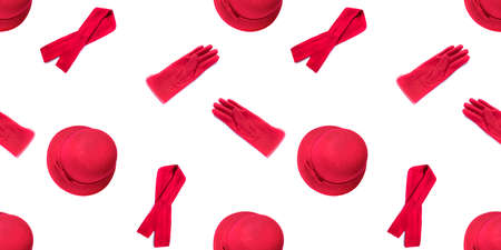 Seamless fashion pattern with red female hat, scarf and gloves isolated on white background. Set for design.の写真素材