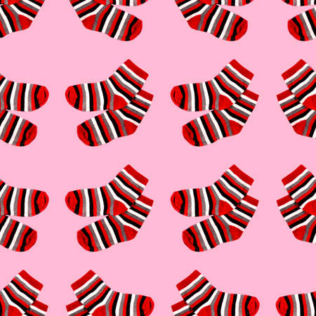 Seamless pattern with red striped socks isolated on pink backgroundの写真素材
