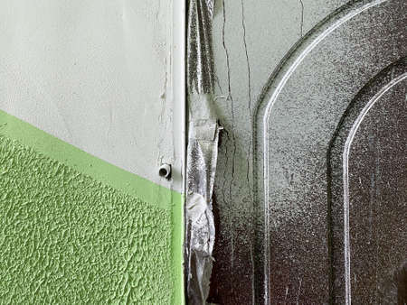 Dirty door after renovation dirtied with paint. Door need cleaningの写真素材