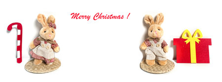 New Year Banner with toy Christmas rabbits, 2023 animal, Santa Claus hat on white background. Lettering Merry Christmas. greeting card. copyspace.の写真素材