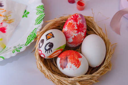 Basket nest with painted chicken eggs. Religious Orthodox holiday Easterの写真素材