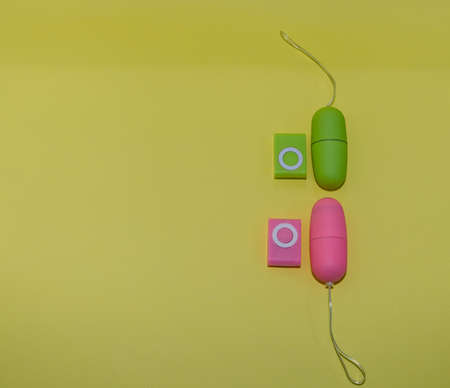 Toys for sex. Dildo vibrating egg on colored background