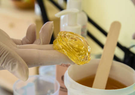Sugar paste for removing body hair. Beauty and body care procedure sugaring