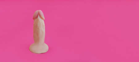 Sex toy vaginal dildo pink on a light backgroundの写真素材