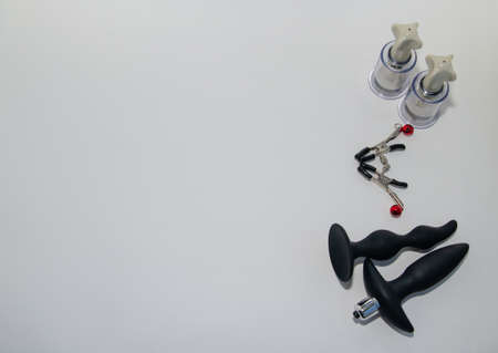 Toys for sex. Anal dildos on a light background. Space for text