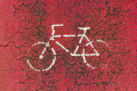 Bike lane sign drawn in white on red bike laneの写真素材