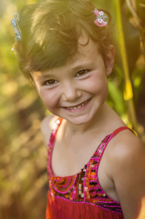 Five years old girl playing in a corn field.の写真素材