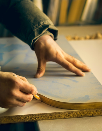 Man doing some carpentry work in a workshop. の写真素材