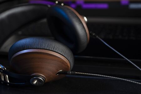 Hi-Fi headphones and computer in a home-studio audio recording and producing