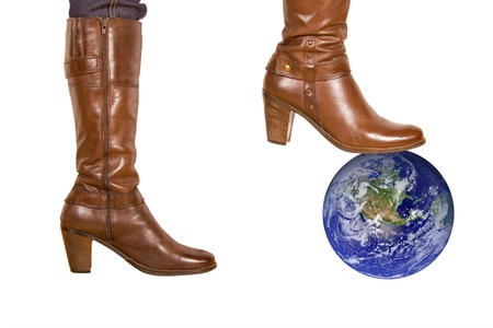 brown woman's boot smash the earth の写真素材