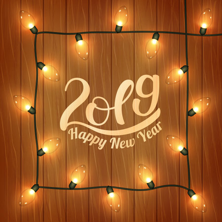 Beautiful New Year s greeting card with handwritten lettering 2019 in square frame of electric garland on wooden background. Vector illustration.のイラスト素材