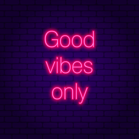 Good vibes only. Glowing pink neon incription on dark brick wall backgroundのイラスト素材