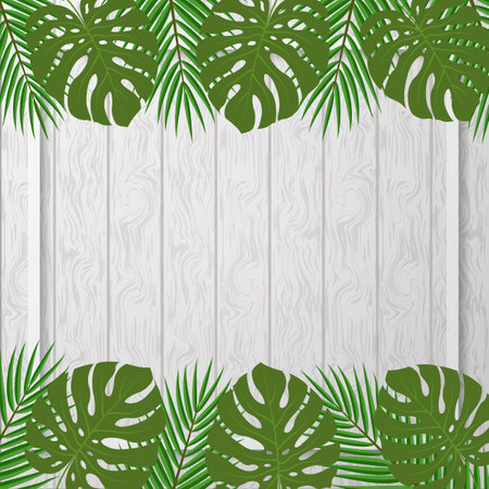Tropical leaves on a gray wooden background. Template for posters, banners or flyers.の写真素材