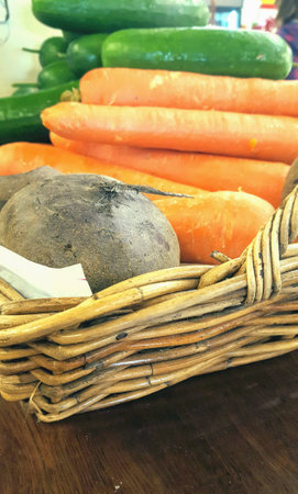Display of fresh Organic vegetables in cane basket.の素材