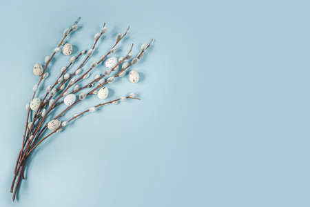 Easter frame with pussy willow branches and colorful Easter eggst, minimal Easter background