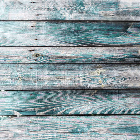 Turquoise blue old vintage wood with vertical boards. Grunge wooden background. Shabby wooden boards backdropの写真素材