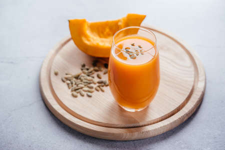 Healthy autumn drinks, pumpkin juice with pumpkin seeds, copy spaceの写真素材