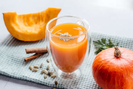 Freshly squeezed pumpkin juice with parsley and pumpkin seedsの写真素材