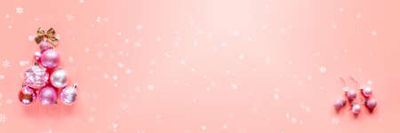 Innovative Christmas tree made of Christmas ornaments on pink background, banner sizeの写真素材
