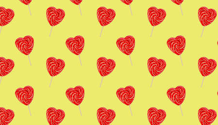Red heart lollipops pattern on yellow background love and Valentine day background