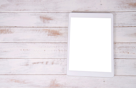 Computer laptop with white screen on wood backgroundの写真素材