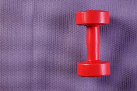 Yoga mat and dumbbellの写真素材