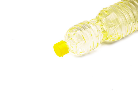 Bottle of vegetable oil for cooking isolated on white backgroundの写真素材