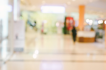 Abstract blur and bokeh shopping mall and department store interior for backgroundの写真素材