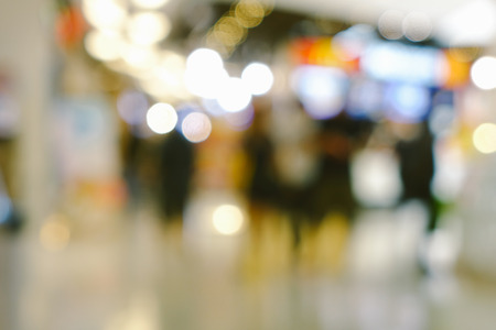 Abstract blur and bokeh shopping mall and department store interior for backgroundの写真素材
