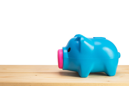 Blue piggy bank on white backgroundの写真素材