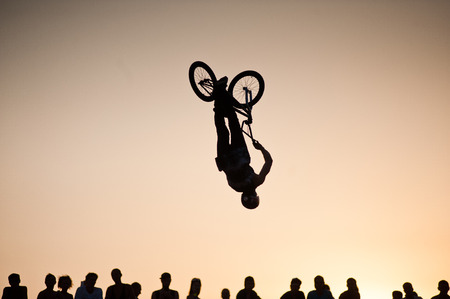 Bike silhouette with people.の写真素材