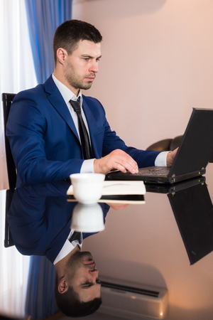 Business man in office with notebook.の写真素材