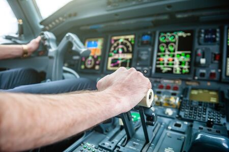 A Pilot hands controlling airplaneの写真素材