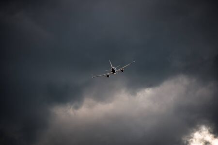 Airplane take off at sunset with clouds
