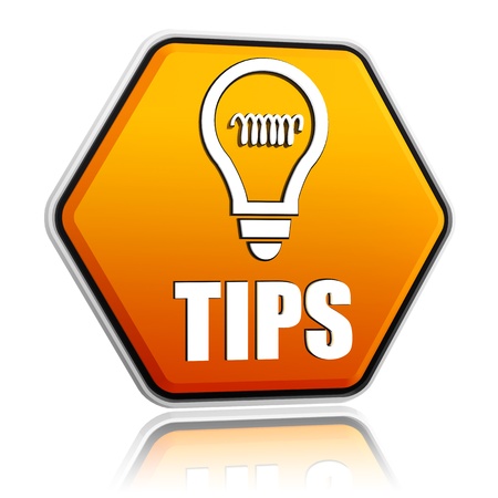 tips and bulb symbol - 3d orange hexagon button with textの写真素材