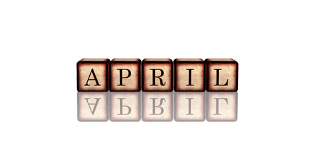 month april - text in 3d retro wooden cubes with letters and reflection, calendar concept elementの写真素材
