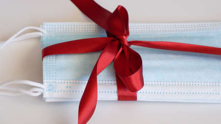 Surgery face mask with red ribbon as a present