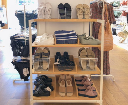 Goods on wooden shelves in Oysho boutiqueのeditorial素材