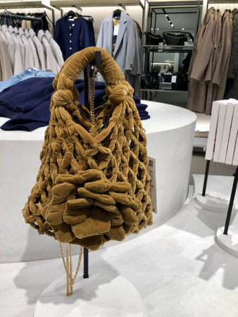 Knitted trendy ladys bag on display in fashion boutiqueの写真素材