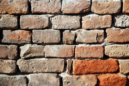 A close up view of an old red brick