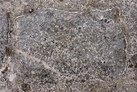 Frozen road after rain in january, close-up