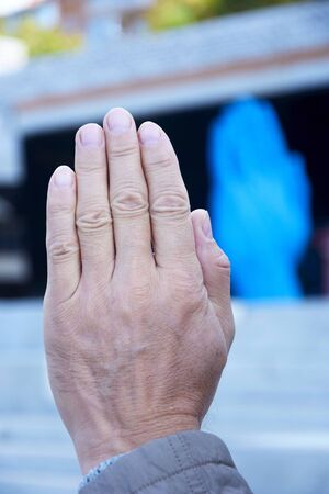 Art object in the form of a huge blue hand - symbol meaning friendship and communication. The author...