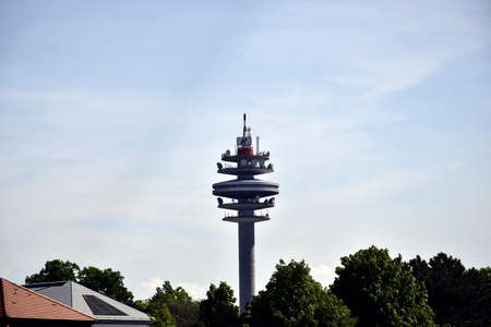 VIENNA, AUSTRIA - MAY 2019: Top of the Arsenalturm with logo of A1 Telekom against the blue sky. Also called funkturm wien arsenal, or Arsenal tower, is  telecommunications & transmission tower.のeditorial素材
